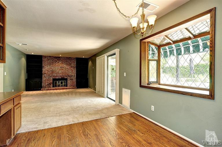540 Fresh Meadows Road Simi Valley, CA 93065 - Photo 11 of 32 a view of an empty room with a window and wooden floor