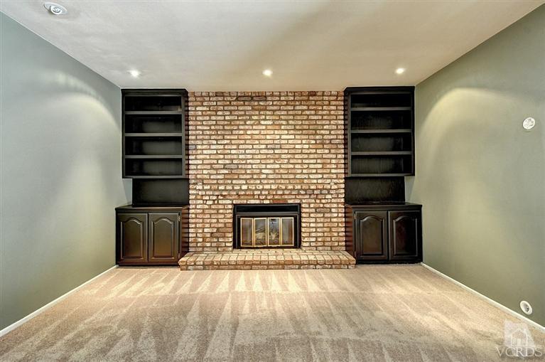 540 Fresh Meadows Road Simi Valley, CA 93065 - Photo 12 of 32 a view of empty room with a fireplace and windows
