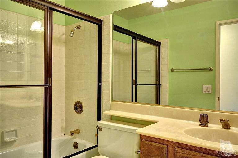 540 Fresh Meadows Road Simi Valley, CA 93065 - Photo 21 of 32 a bathroom with a sink and a mirror