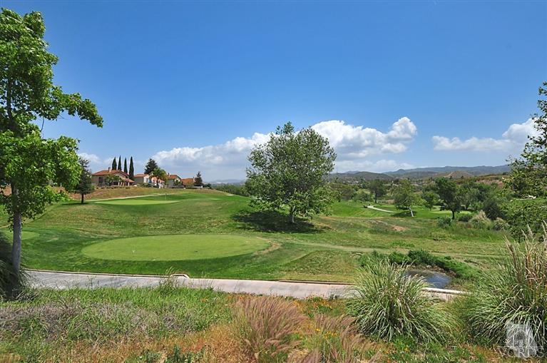 540 Fresh Meadows Road Simi Valley, CA 93065 - Photo 31 of 32 a view of a golf course with a lake