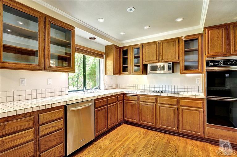 540 Fresh Meadows Road Simi Valley, CA 93065 - Photo 9 of 32 a kitchen with stainless steel appliances granite countertop a sink and cabinets