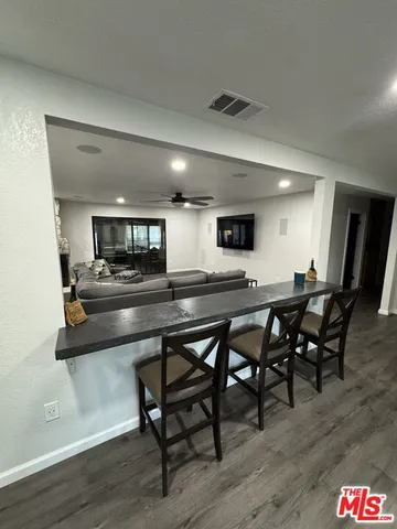 a view of a livingroom with wooden floor