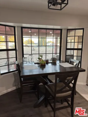 a kitchen with stainless steel appliances kitchen island granite countertop a refrigerator and a stove