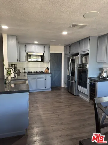 a view of hallway with wooden floor