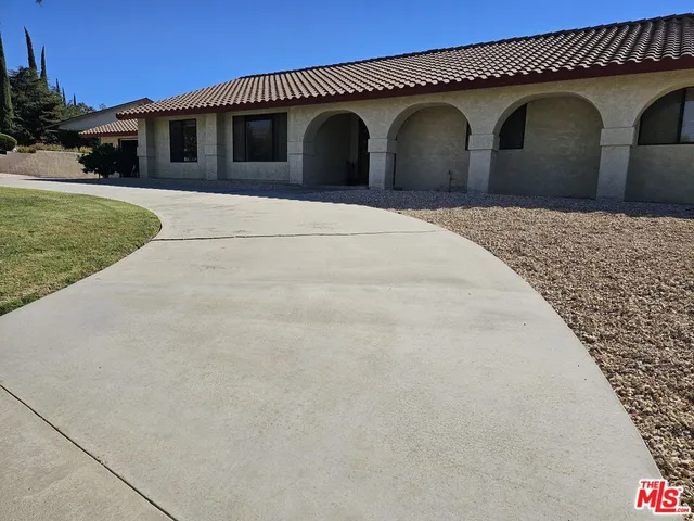 a front view of a house with yard