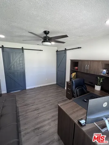 a room with gym equipment and a flat screen tv