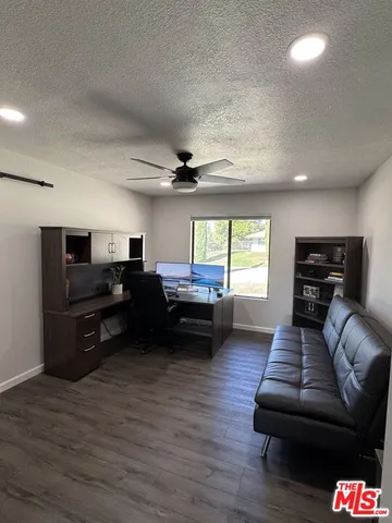 a bedroom with two beds and a large window