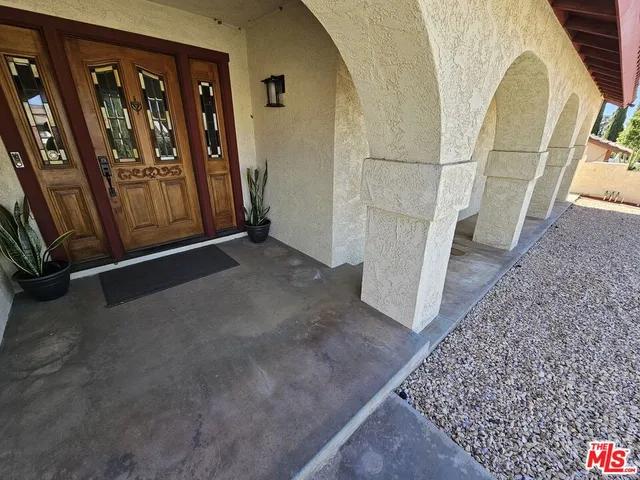 a view of a livingroom with furniture and staircase