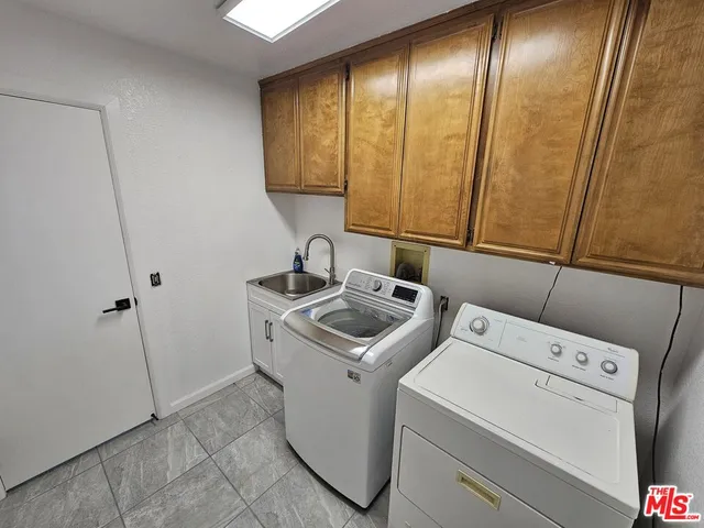 a view of a house with backyard porch and sitting area