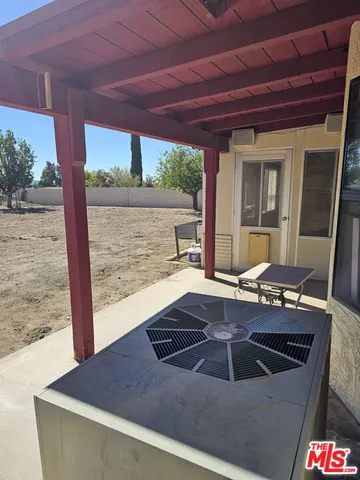 a view of a big house next to a big yard