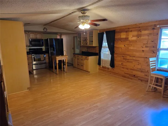 a room with furniture pool table and window