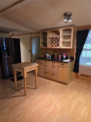 a kitchen with stainless steel appliances a stove a refrigerator and a sink