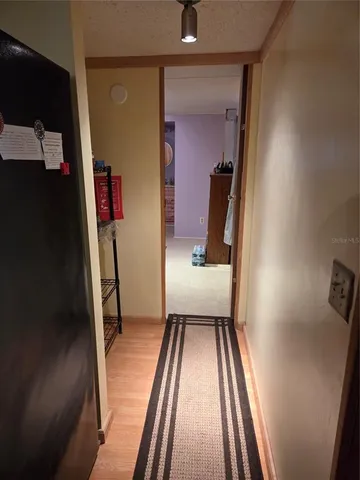 a view of a hallway view with staircase