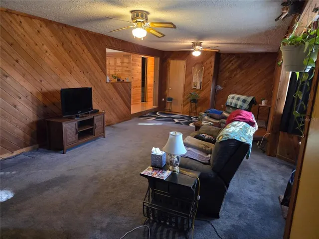 a living room with furniture flat screen tv and a fireplace