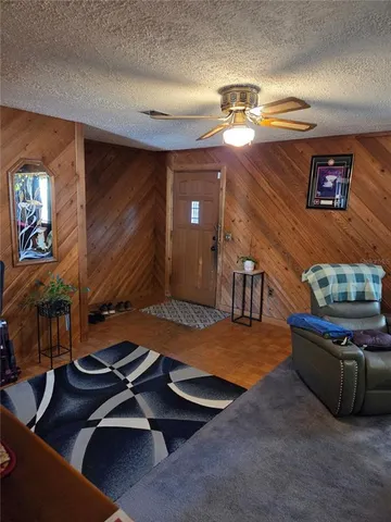 a room with furniture pool table and window