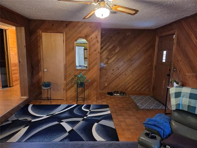 a room with furniture and wooden floor