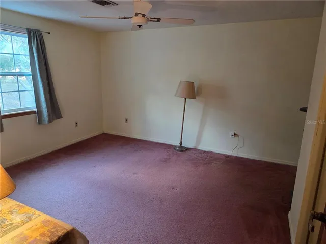 a view of empty room with windows