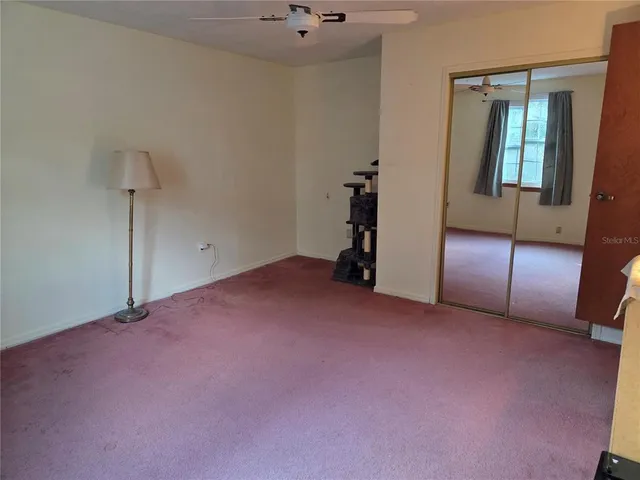 an empty room with fan