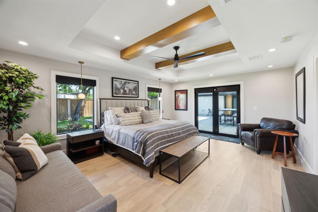 14406 Overview Drive Dallas, TX 75254 - Photo 16 of 39 a spacious bedroom with a bed and glass walk in closet