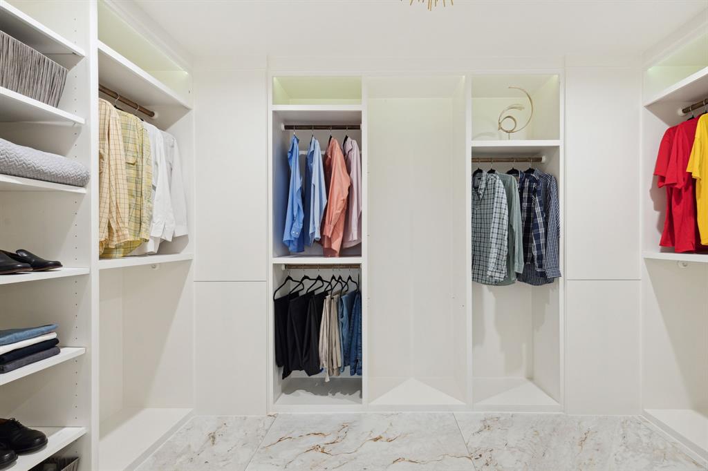 14406 Overview Drive Dallas, TX 75254 - Photo 21 of 39 a view of walk in closet with clothes and shoes