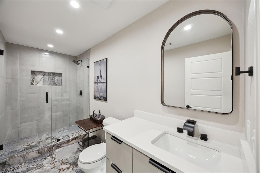 14406 Overview Drive Dallas, TX 75254 - Photo 28 of 39 a bathroom with a sink a toilet and shower