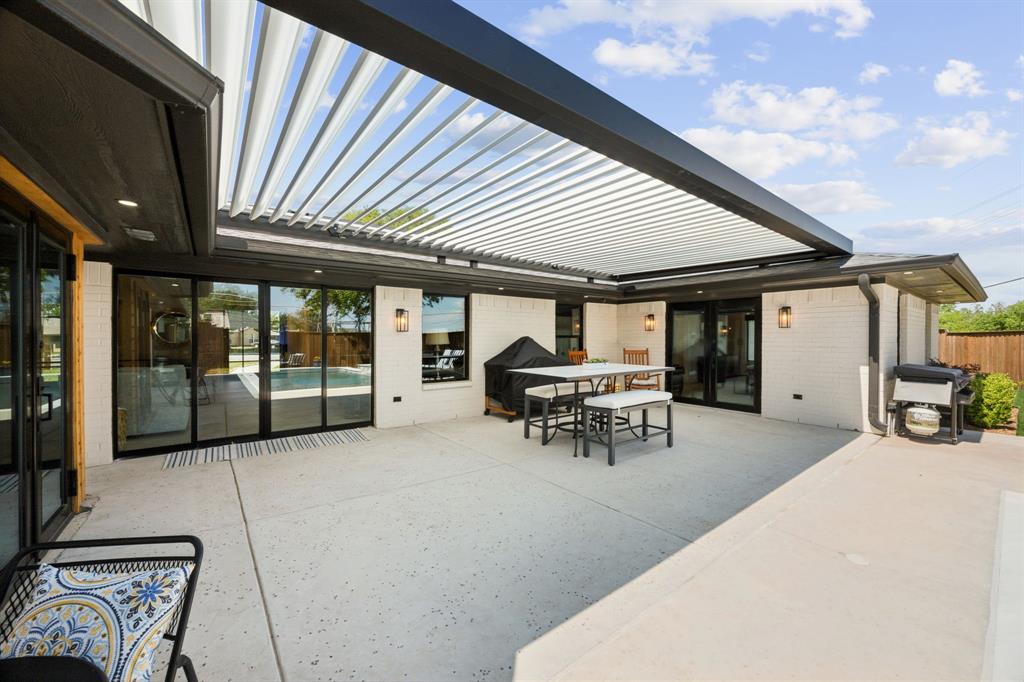 14406 Overview Drive Dallas, TX 75254 - Photo 32 of 39 a view of a patio with table and chairs and potted plants