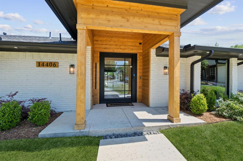 14406 Overview Drive Dallas, TX 75254 - Photo 4 of 39 a front view of a house with a yard