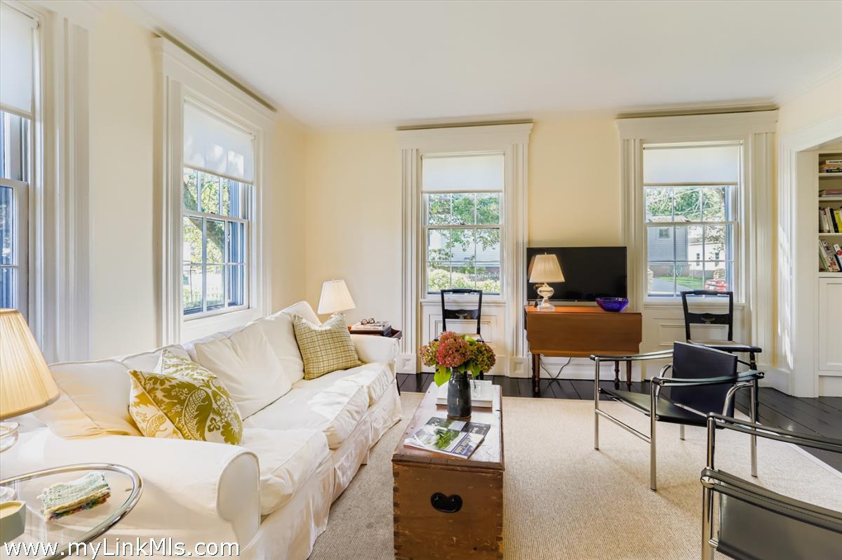 27 Spring Street Vineyard Haven, MA 02568 - Photo 21 of 58 a living room with furniture and a floor to ceiling window