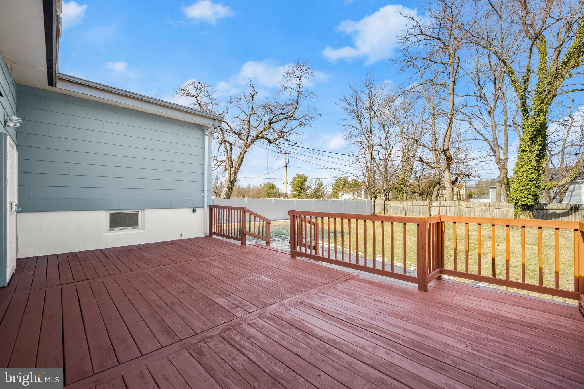 3412 Milford Mill Road Baltimore, MD 21244 - Photo 25 of 28 a view of a deck with wooden floor and fence