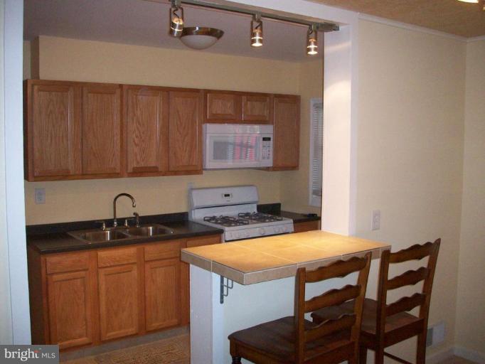 1969 Haselmere Road Dundalk, MD 21222 - Photo 3 of 14 New cabinets, Appliances, and Bar!