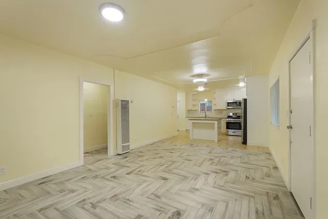 a view of a kitchen with kitchen and refrigerator