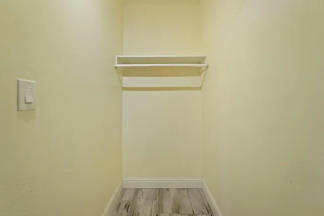 a view of small space with empty racks on the wall