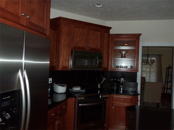36 Britts Ridge Cumberland, RI 02864 - Photo 3 of 18 a kitchen with a sink and refrigerator