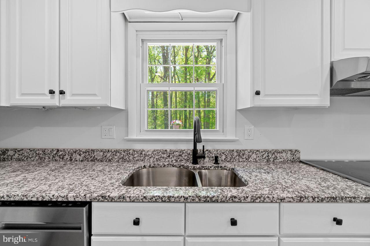 27475 Three Notch Road Mechanicsville, MD 20659 - Photo 18 of 45 Kitchen Sink and prep area view to backyard and de