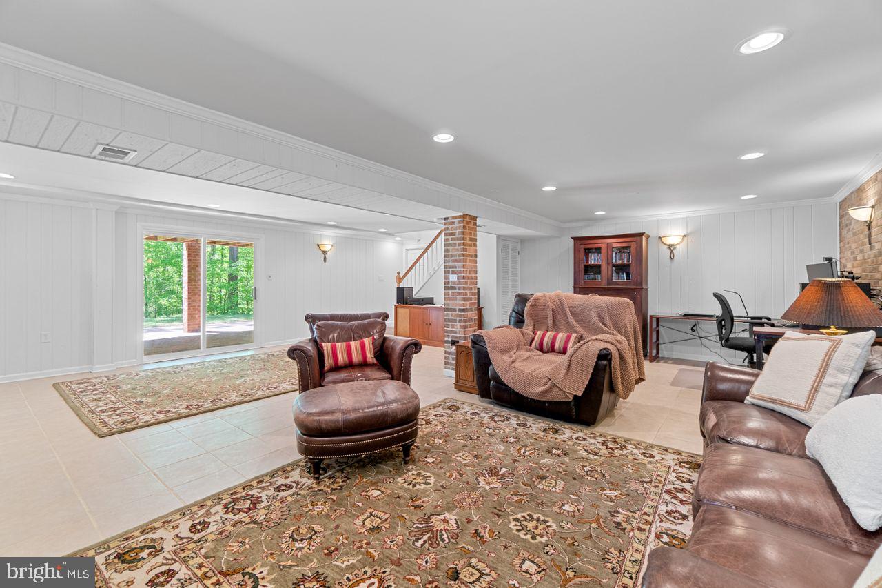 27475 Three Notch Road Mechanicsville, MD 20659 - Photo 35 of 45 Rec Room view toward backyard and internal stairs