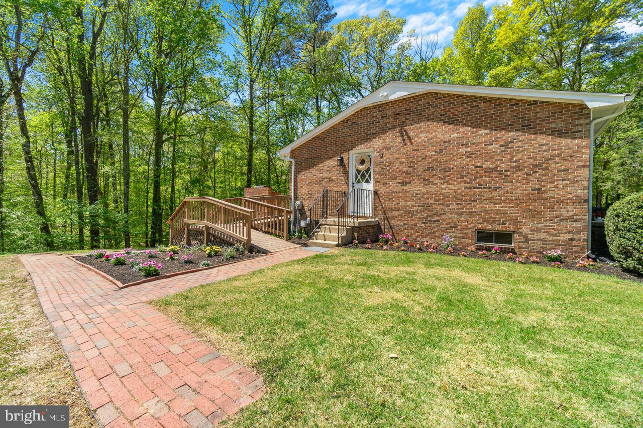 27475 Three Notch Road Mechanicsville, MD 20659 - Photo 41 of 45 Side entry and flower beds towards ramp and stairs