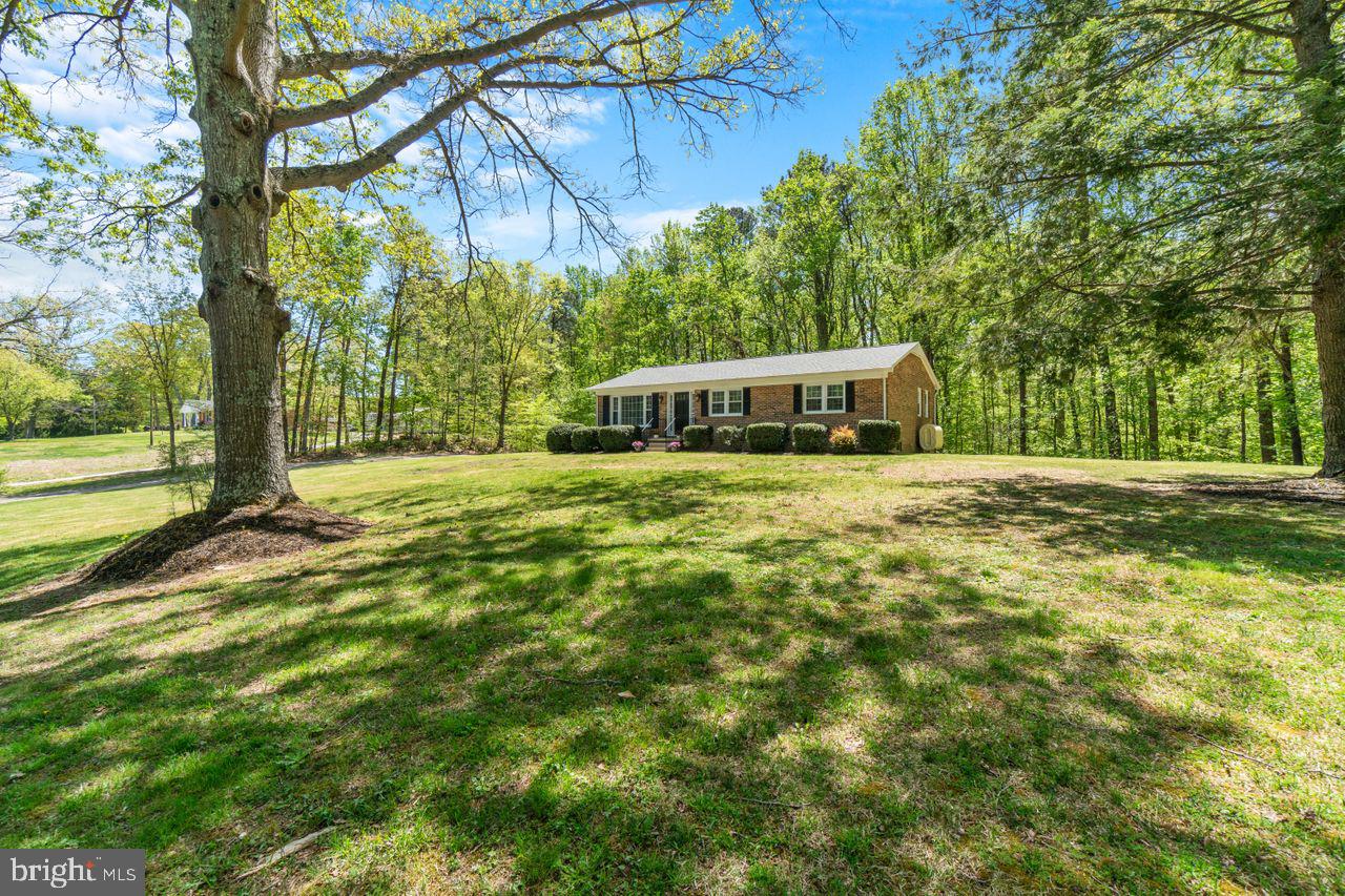 27475 Three Notch Road Mechanicsville, MD 20659 - Photo 7 of 45 mature trees provide filtered light into home