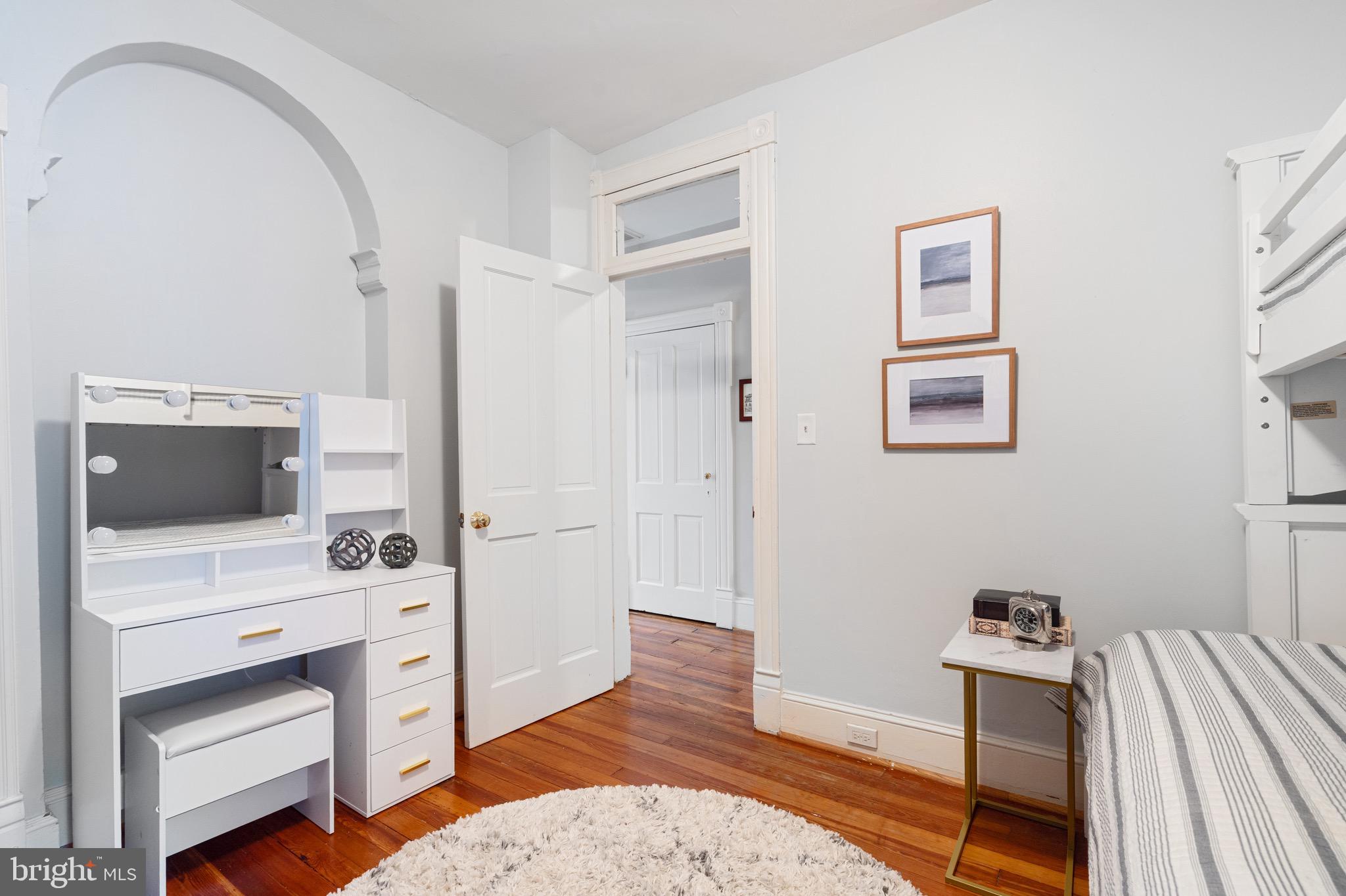 207 10th Street Northeast Washington, DC 20002 - Photo 29 of 40 a room with a bed and a view of kitchen