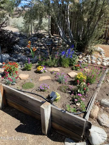 a view of a bench sitting in the backyard of a house