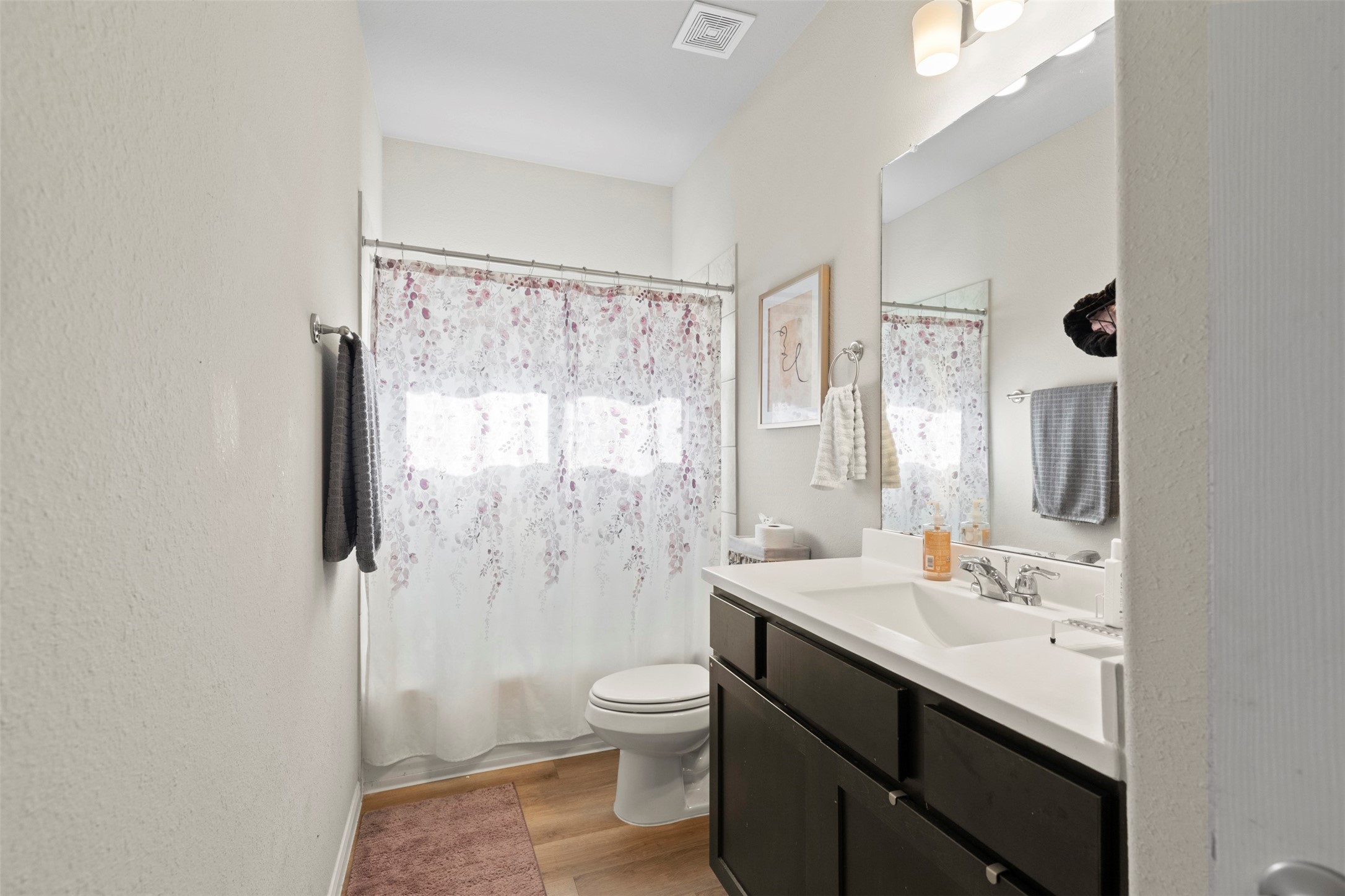 6444 Wenlock Drive Houston, TX 77048 - Photo 13 of 21 a bathroom with a double vanity sink toilet and shower