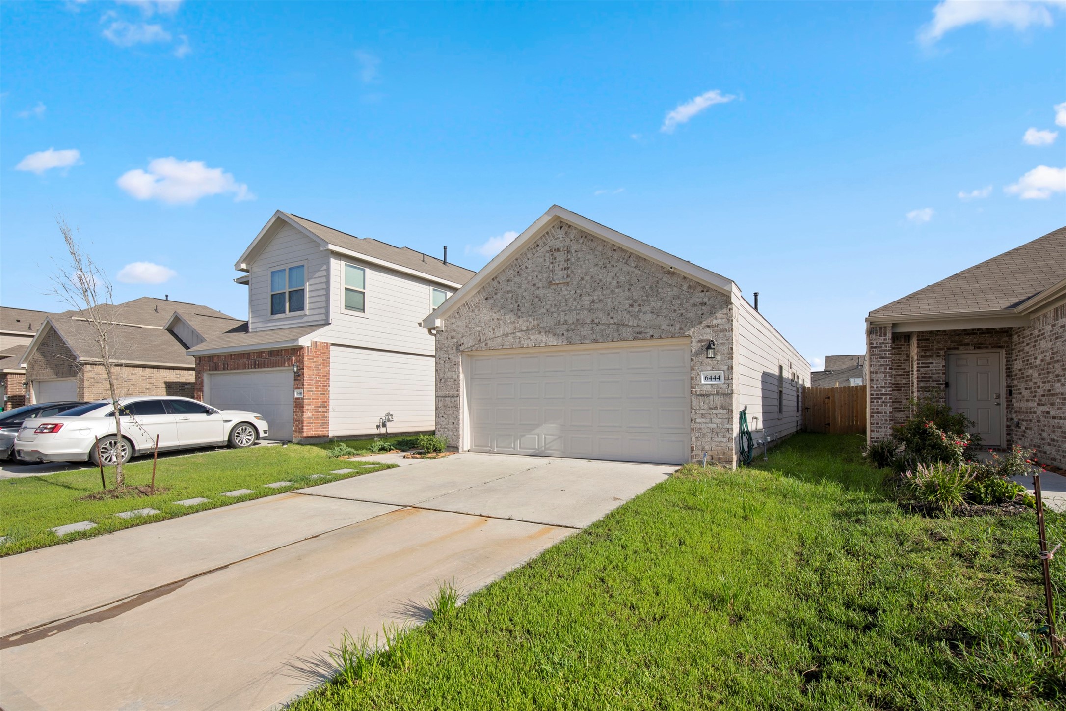 6444 Wenlock Drive Houston, TX 77048 - Photo 3 of 21 a front view of a house with a yard and garage