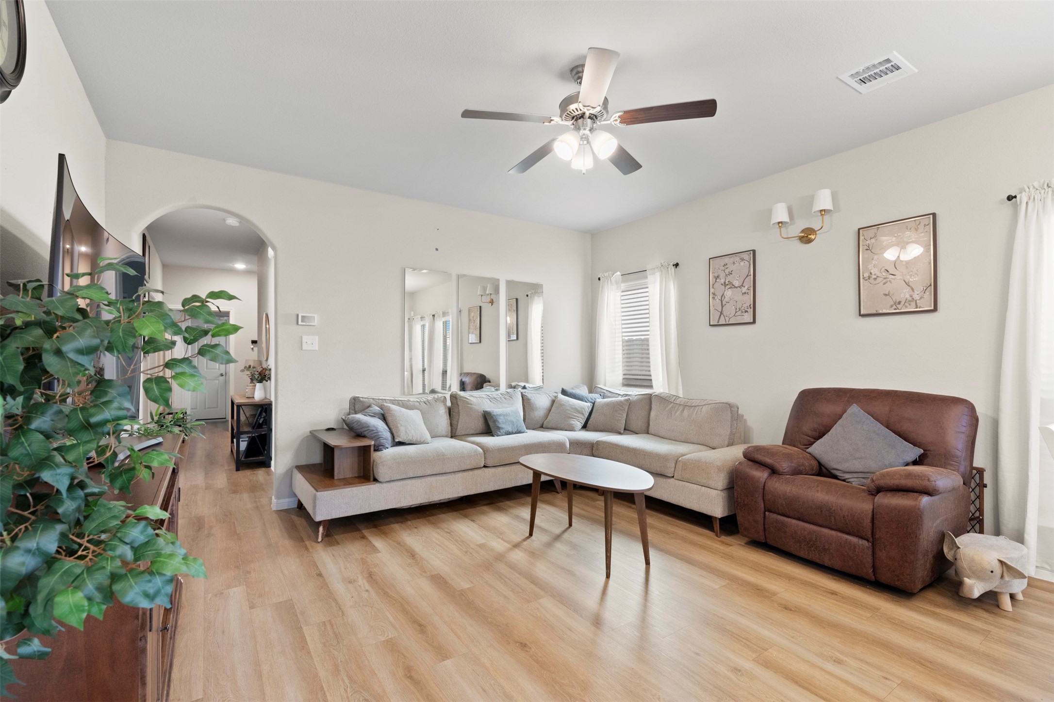 6444 Wenlock Drive Houston, TX 77048 - Photo 7 of 21 a living room with furniture and a potted plant