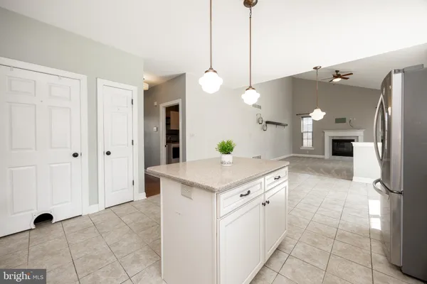a kitchen with a sink and refrigerator