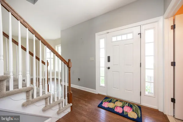a view of an entryway with wooden floor