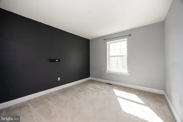 a view of a bedroom with window