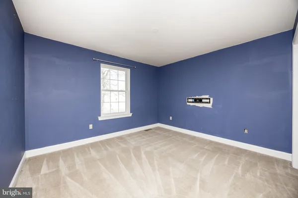 a view of a big room with windows