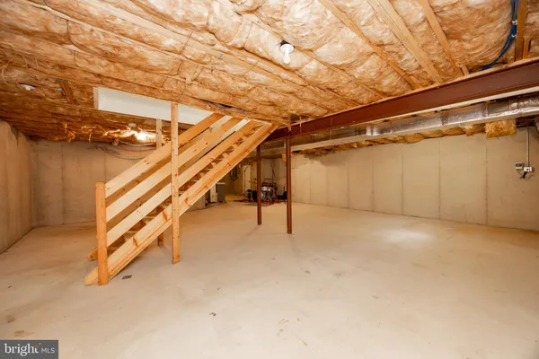 a view of an empty room with stairs