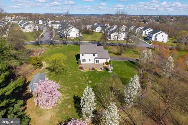 an aerial view of a house with a lake view