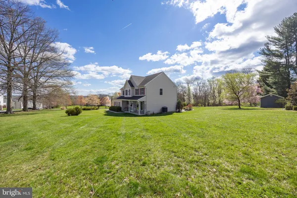 a view of a house with a backyard