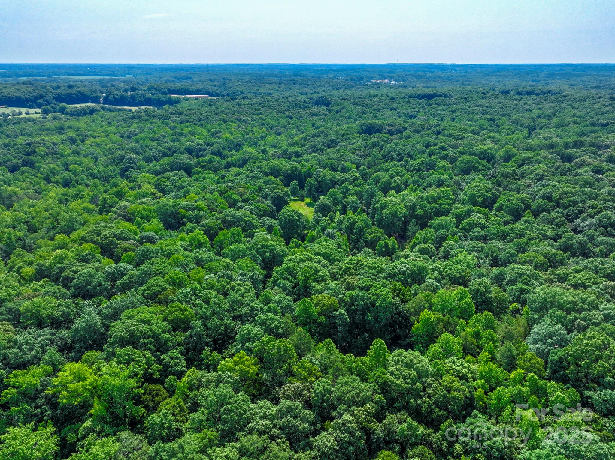 Lot 33 Valley Farm Road, Unit 33 Waxhaw, NC 28173 - Photo 17 of 35 an aerial view of residential houses with outdoor space and trees